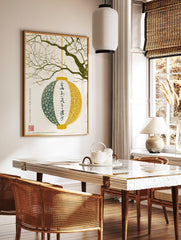 Japanese lantern hanging from cherry blossom tree branch with kanji calligraphy on a white, in a styled room mockup