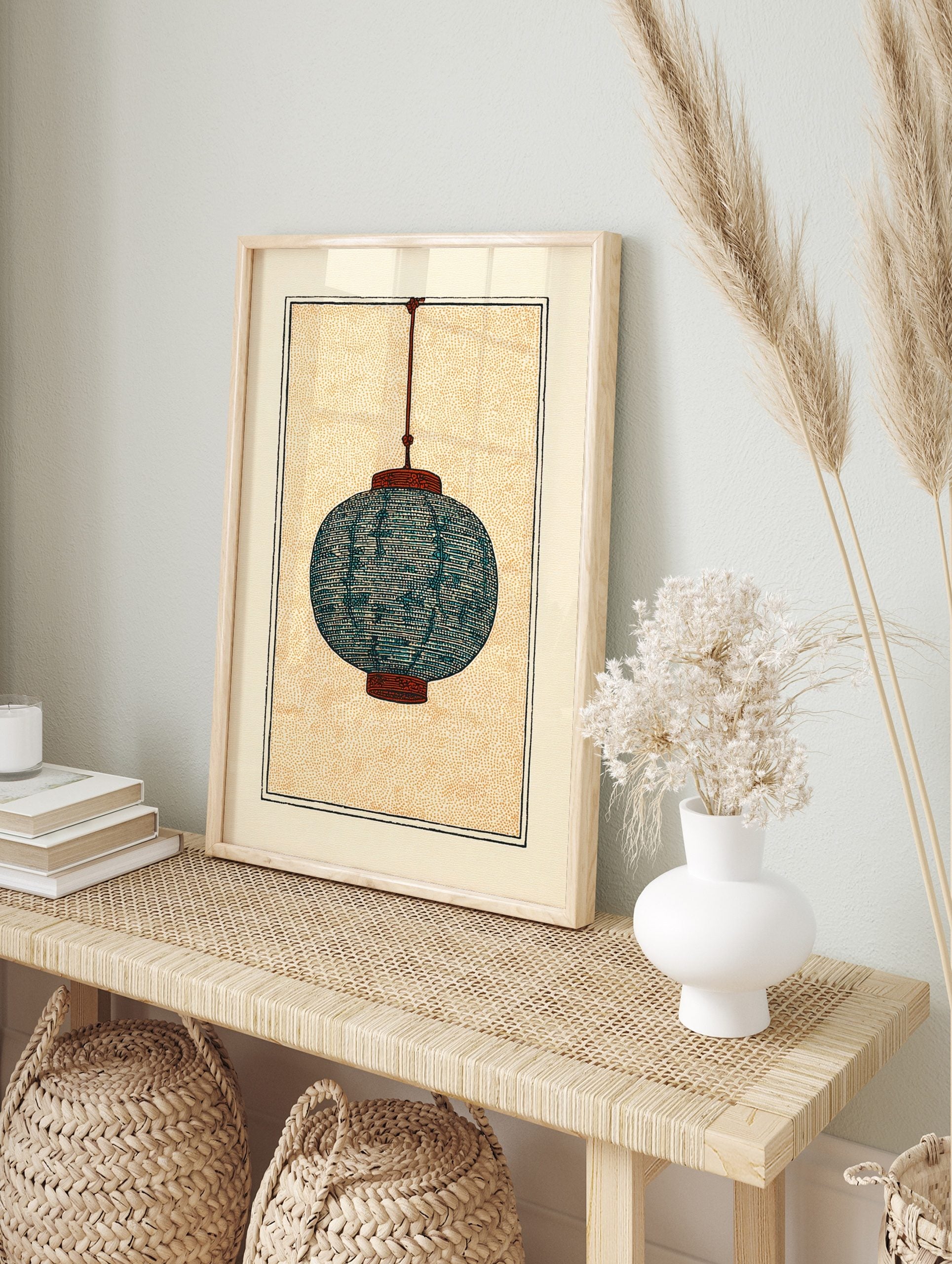 Illustrative print of a teal blue Japanese paper lantern with burnt orange details, hanging, in an alternate framed mockup
