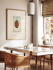 Orange Japanese lantern with 'Ume Musume' kanji characters, hanging against a textured teal, in a styled room mockup