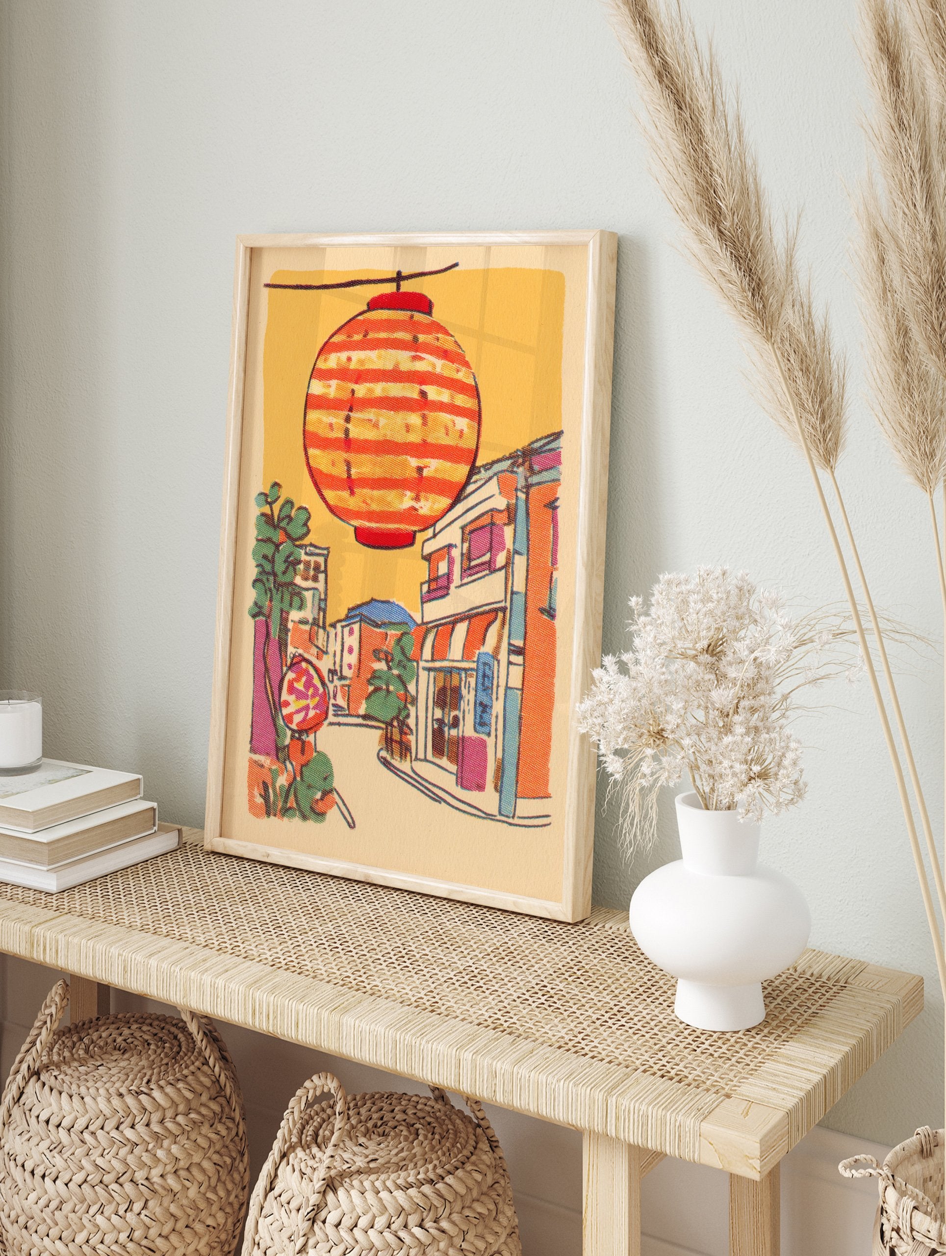 Illustrative print of a Japanese street scene with a large orange striped lantern hanging above colorful buildings and trees. - Image 3