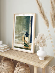 Japanese lantern on a window sill overlooking a watercolour cityscape at dusk with kanji text, in an alternate framed mockup