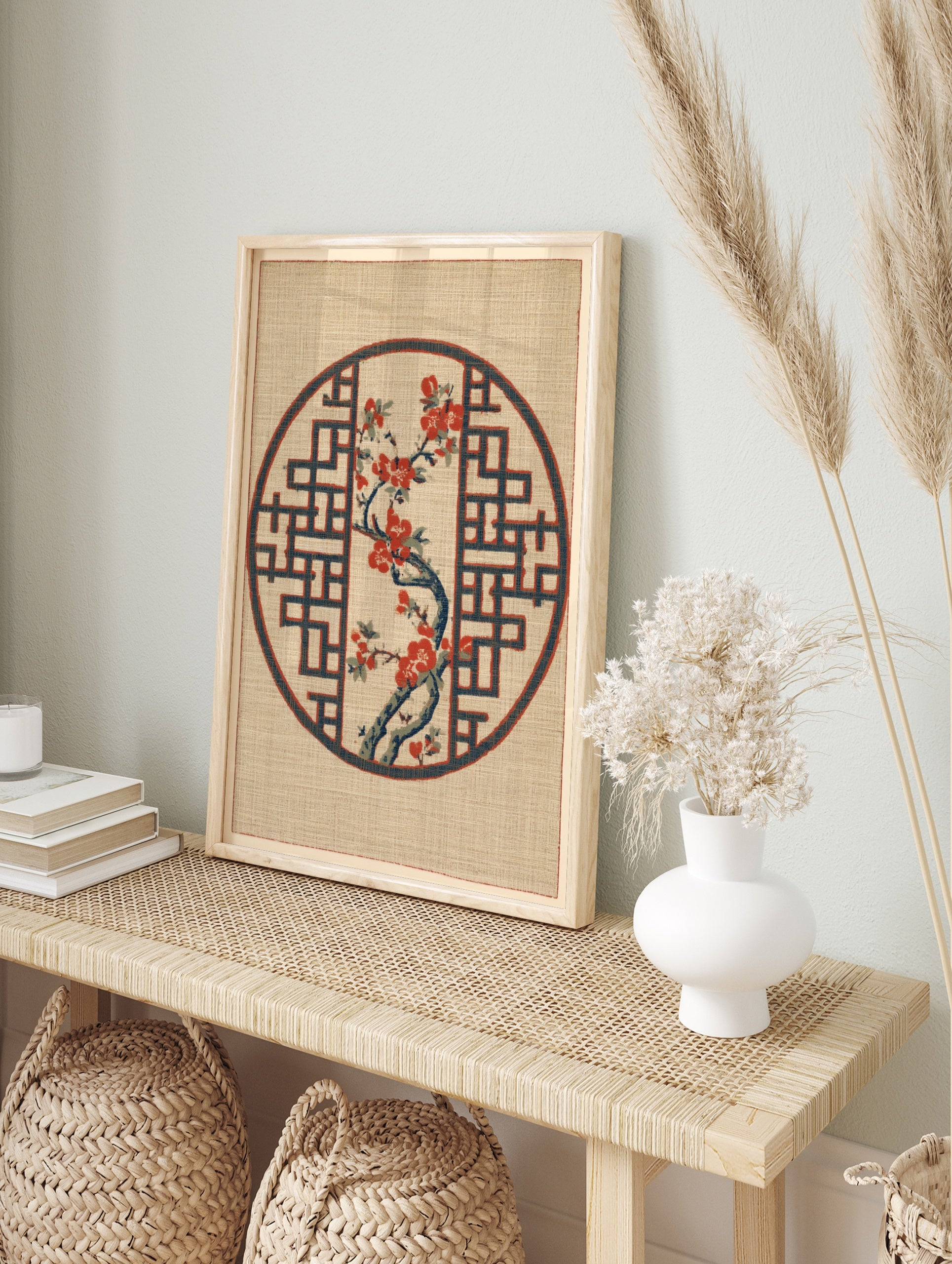 Japanese-inspired circular print featuring a red flowering branch inside a blue geometric, in an alternate framed mockup