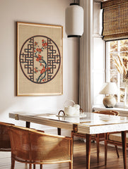 Japanese-inspired circular print featuring a red flowering branch inside a blue geometric lattice, in a styled room mockup