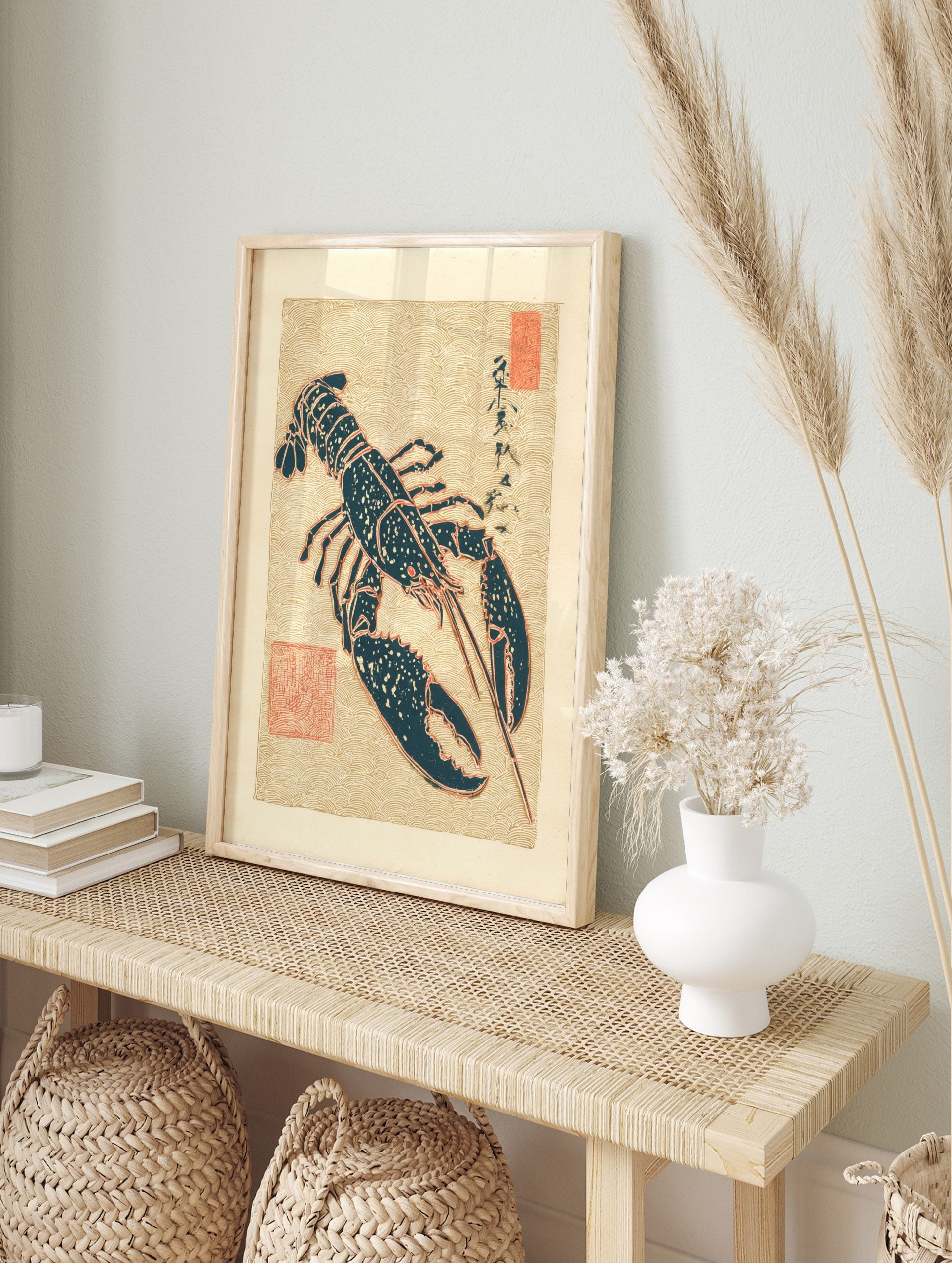 Japanese lobster illustration in dark teal with red outlines on a beige wave pattern, in an alternate framed mockup