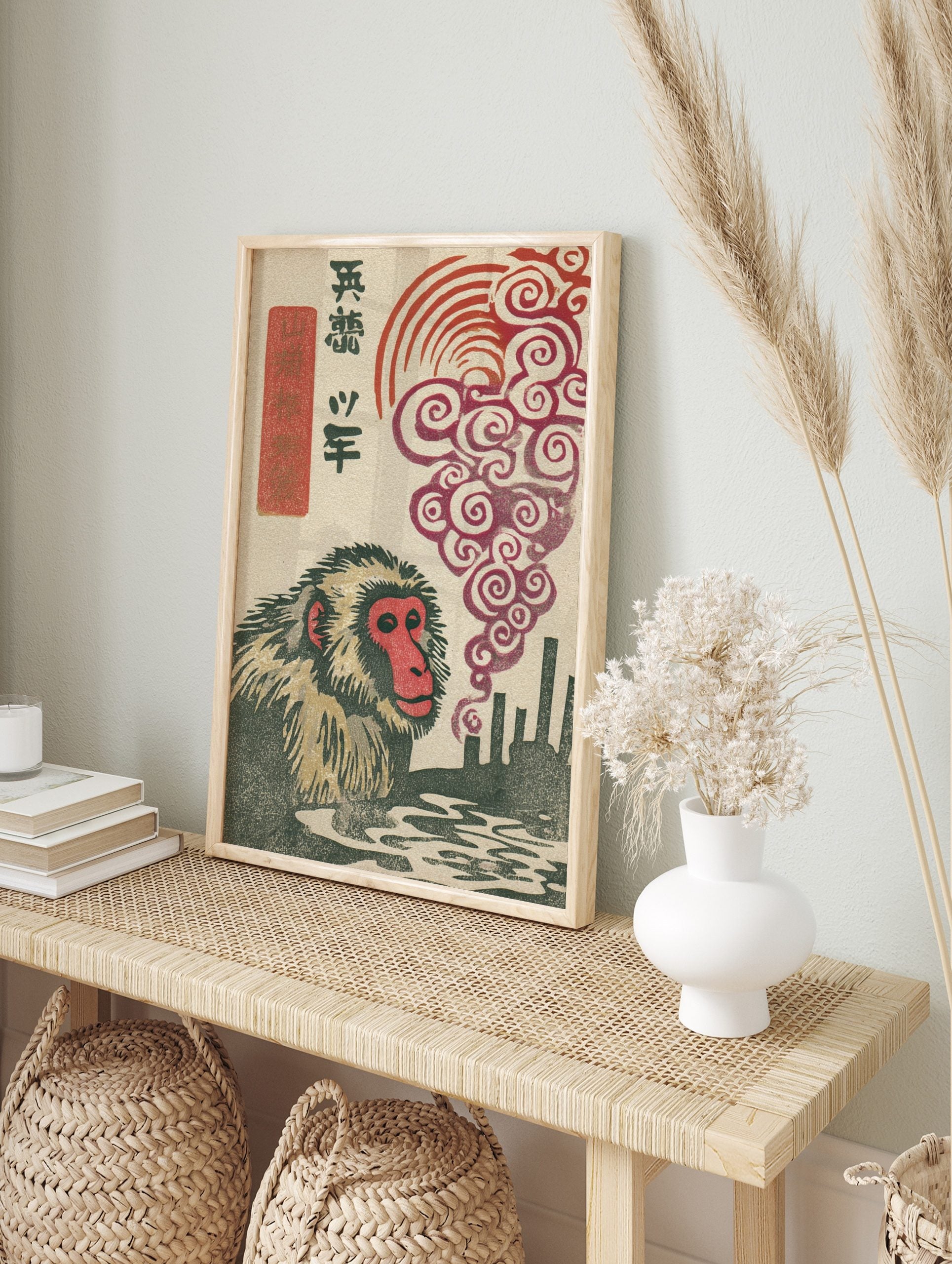 Japanese macaque woodblock print with red-faced monkey, industrial smokestacks, swirling red, in an alternate framed mockup