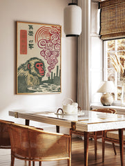 Japanese macaque woodblock print with red-faced monkey, industrial smokestacks, swirling red smoke, in a styled room mockup