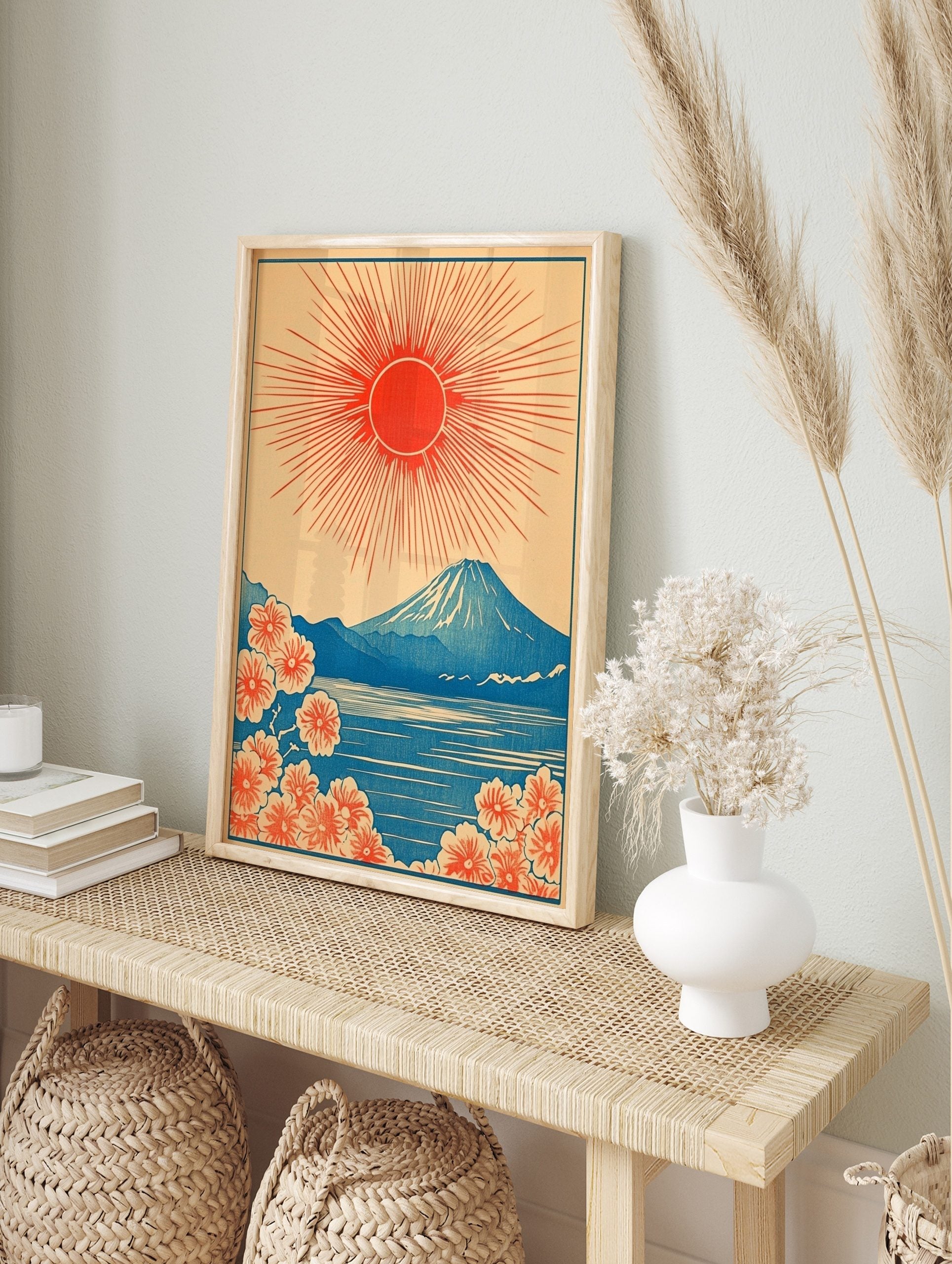 Japanese Mount Fuji print with red rising sun, blue lake, and orange cherry blossoms in, in an alternate framed mockup