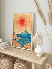 Japanese Mount Fuji print with red rising sun, blue lake, and orange cherry blossoms in, in an alternate framed mockup