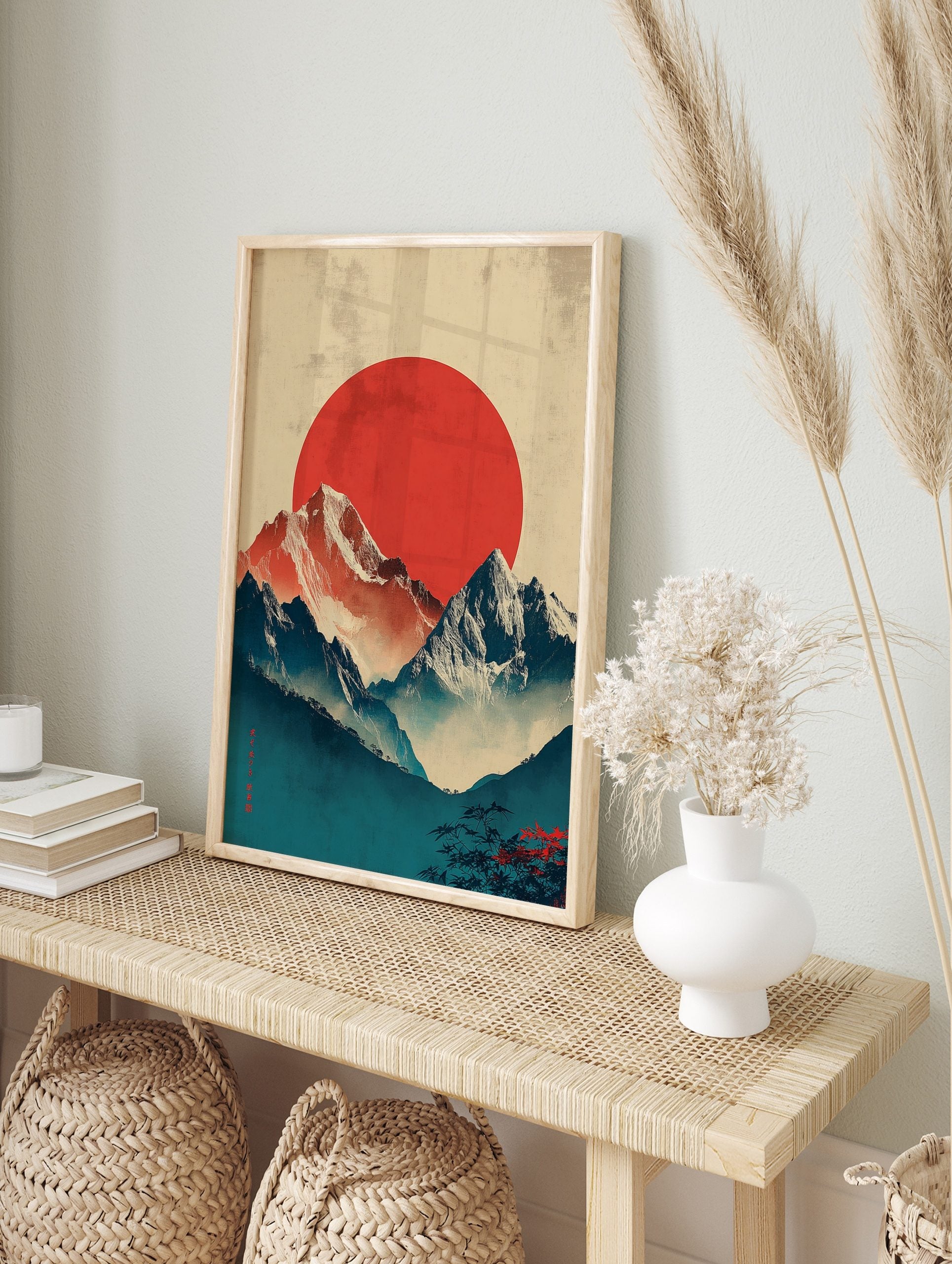 Japanese mountain landscape with red sun, snow-capped peaks, misty blue valleys, and Japanese, in an alternate framed mockup