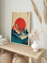 Japanese mountain landscape with red sun, snow-capped peaks, misty blue valleys, and Japanese, in an alternate framed mockup