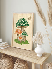 Japanese woodblock print of a mushroom cluster with green and orange caps, brown stalks, and, in an alternate framed mockup
