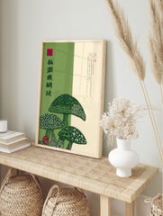 Japanese mushroom illustration art print with green fungi, patterned caps, and vertical kanji, in an alternate framed mockup