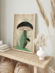 Japanese woodblock-style print of two dark-capped mushrooms with gills, surrounded by green, in an alternate framed mockup