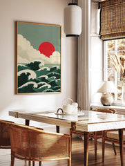 Japanese-style ocean waves with white crests, a red sun, and layered clouds in a green and cream, in a styled room mockup