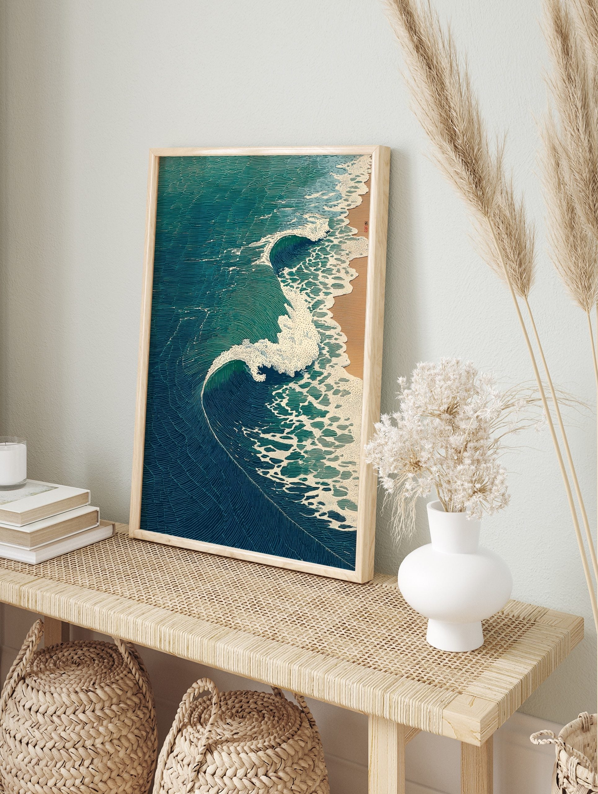 Japanese woodblock style art print of ocean waves with blue and teal water crashing onto a, in an alternate framed mockup