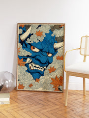 Blue Japanese Oni mask illustration with horns and fangs, surrounded by swirling clouds and orange maple leaves. - Image 2