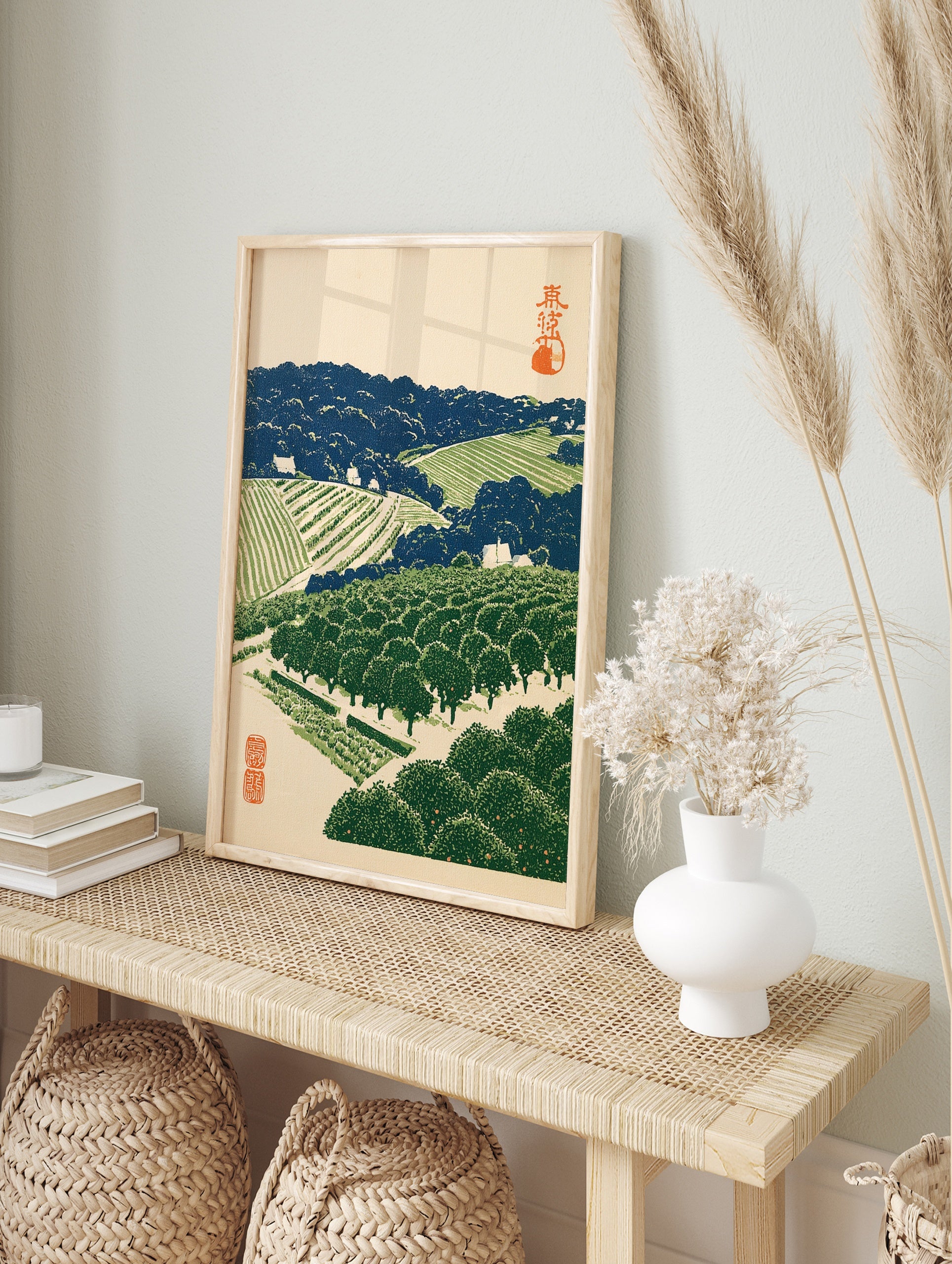 Japanese landscape woodblock style print of a terraced orchard with orange trees, blue hills, in an alternate framed mockup