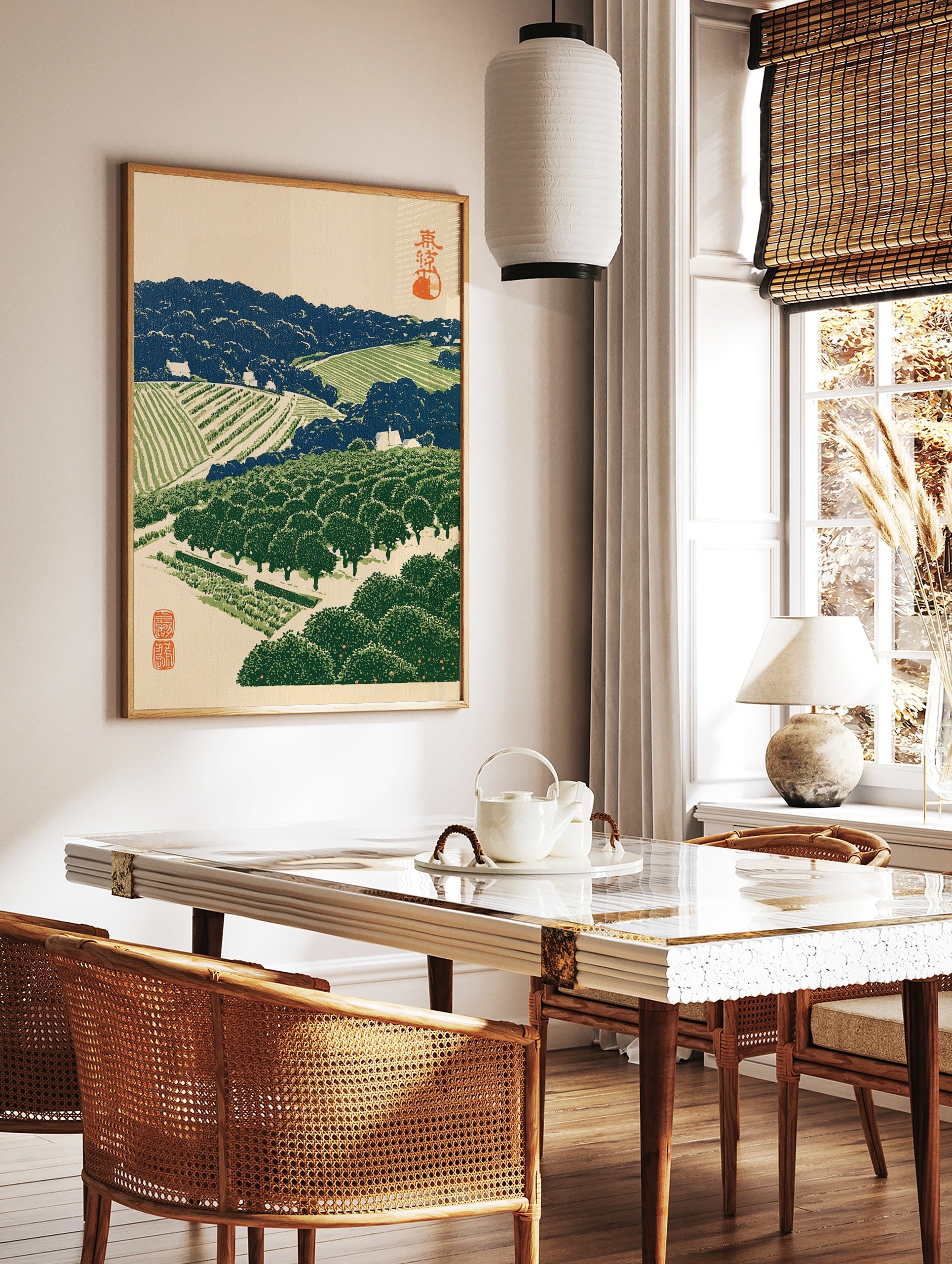 Japanese landscape woodblock style print of a terraced orchard with orange trees, blue hills, and, in a styled room mockup