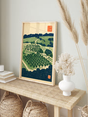 Japanese woodblock-style orchard landscape print with trees, terraced fields, and traditional, in an alternate framed mockup