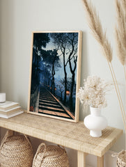 Japanese stone staircase with glowing lanterns and distant pagoda at twilight, illustrative, in an alternate framed mockup