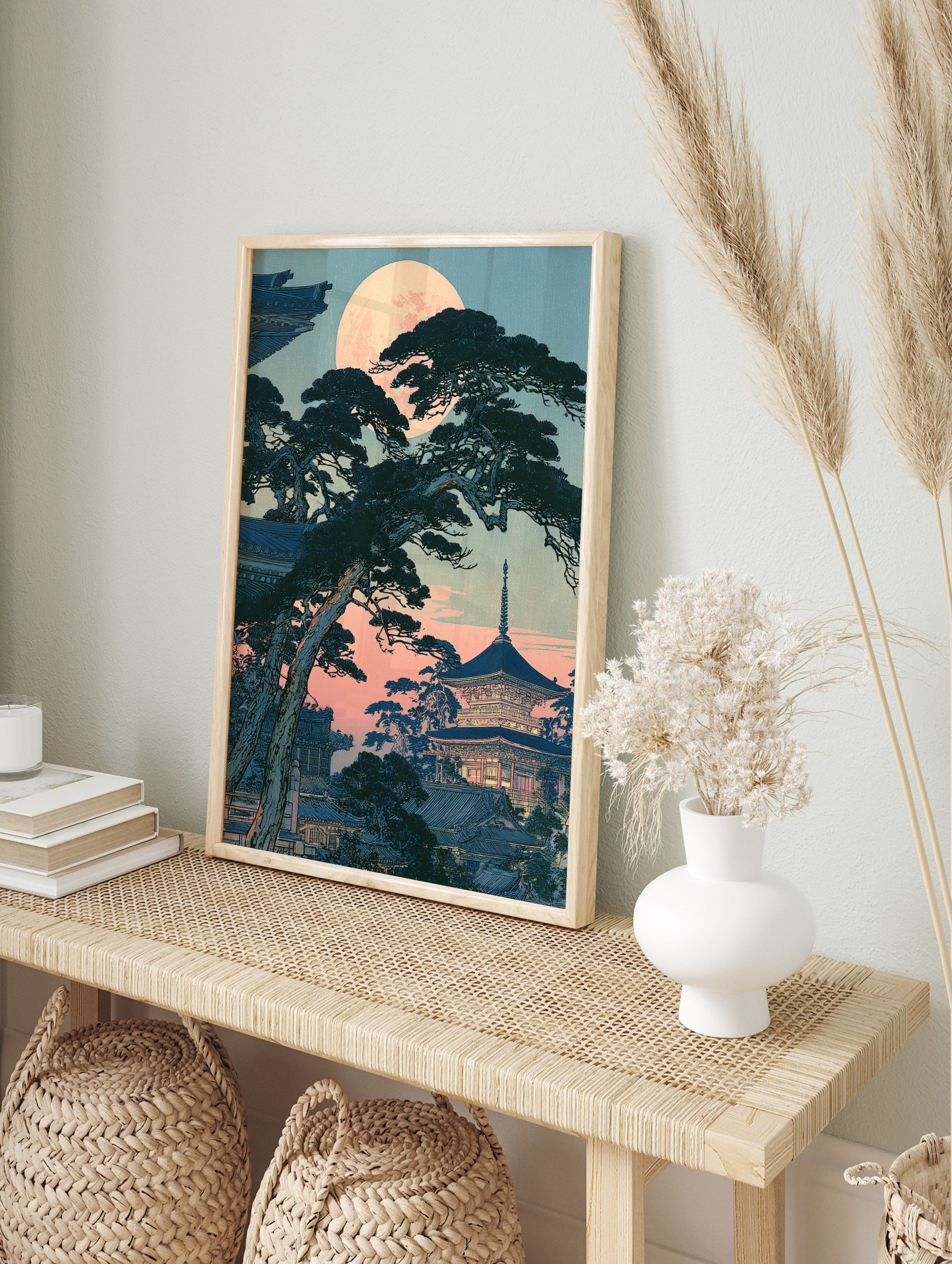 Japanese pagoda with pine trees under a full moon, illustrative twilight landscape art print, in an alternate framed mockup