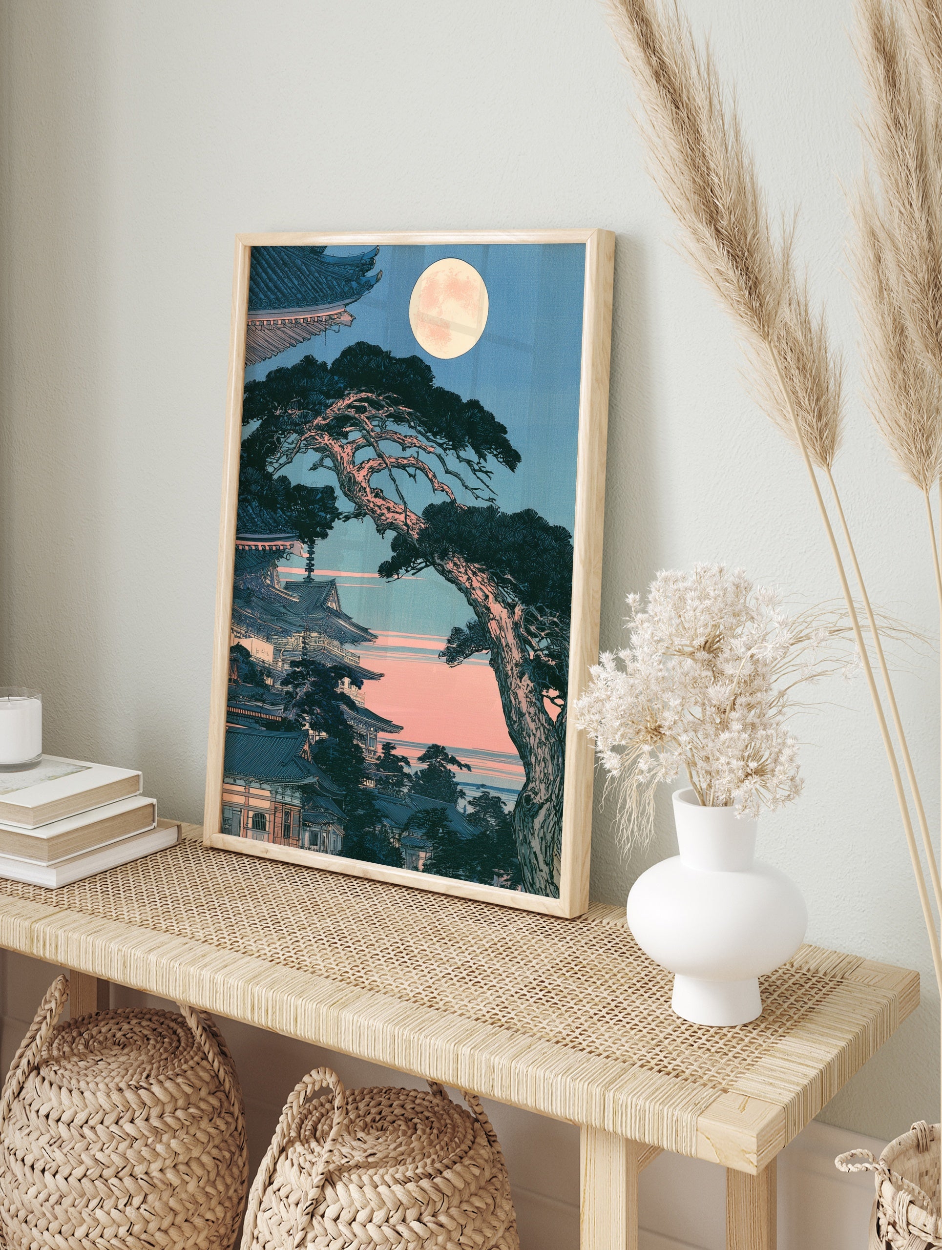 Japanese temple pagoda with pine tree and full moon in a traditional woodblock art style print, in an alternate framed mockup