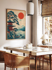 Japanese pagoda temple and pine tree on a cliff overlooking a lake with a red sun and mountains, in a styled room mockup