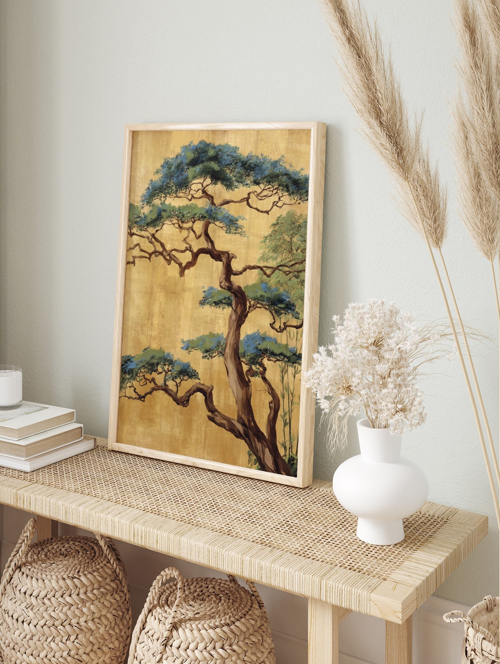 Japanese pine tree with gnarled brown trunk and blue-green foliage on a textured gold, in an alternate framed mockup