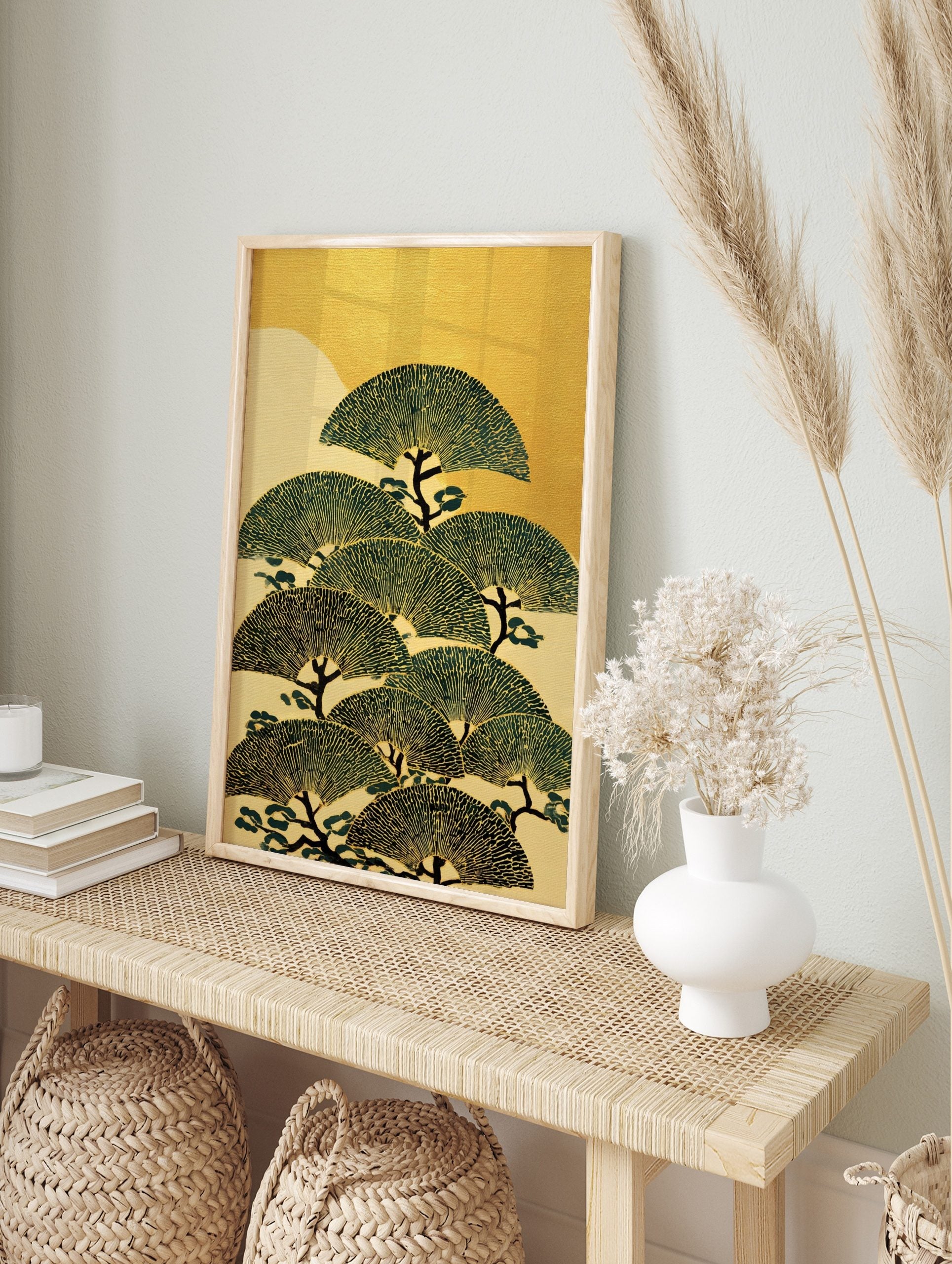 Stylised Japanese pine trees with fan-shaped green foliage and dark trunks against a gold and, in an alternate framed mockup