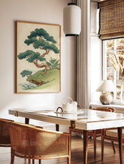 Stylised Japanese pine tree illustration on a grassy cliff with green foliage and brown trunk, in a styled room mockup