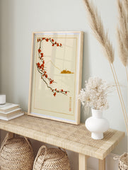 Japanese art print with red plum blossom branch and minimalist Mount Fuji outline on a, in an alternate framed mockup