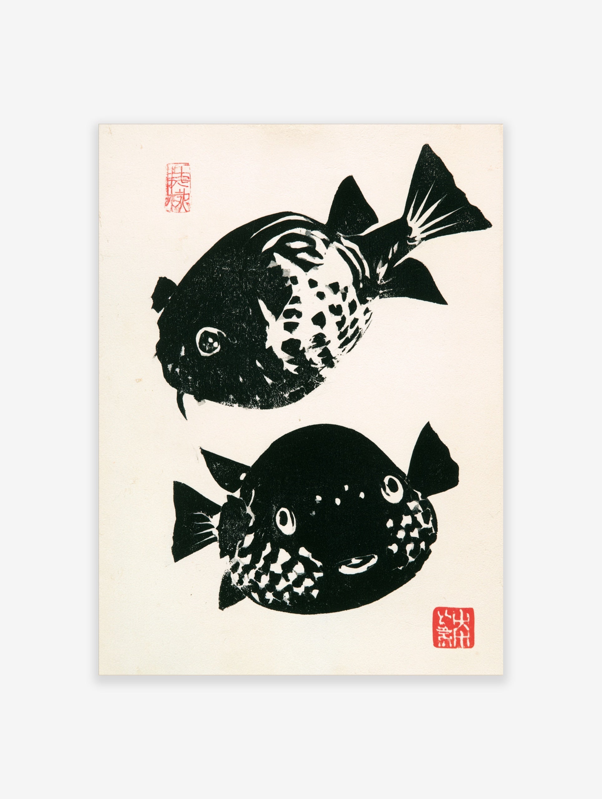 Japanese woodblock style pufferfish print with high-contrast black and white fish and red stamps on a white background