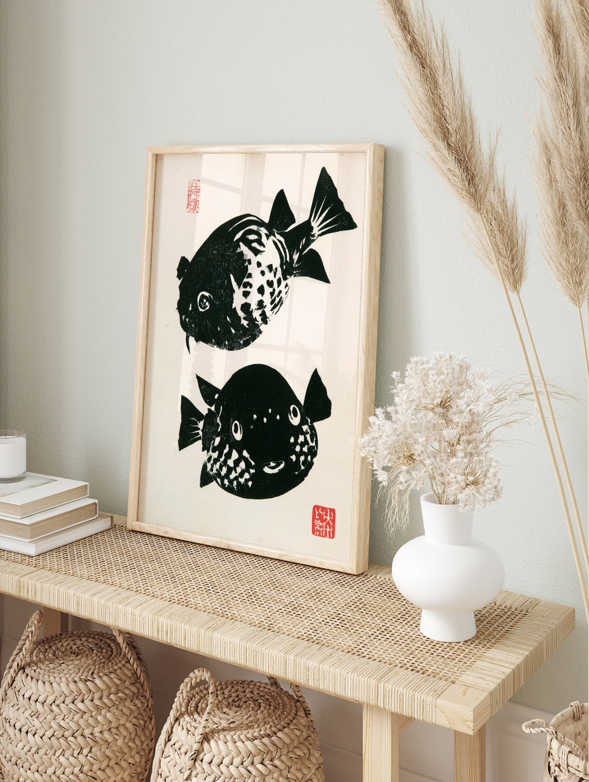 Japanese woodblock style pufferfish print with high-contrast black and white fish and red, in an alternate framed mockup