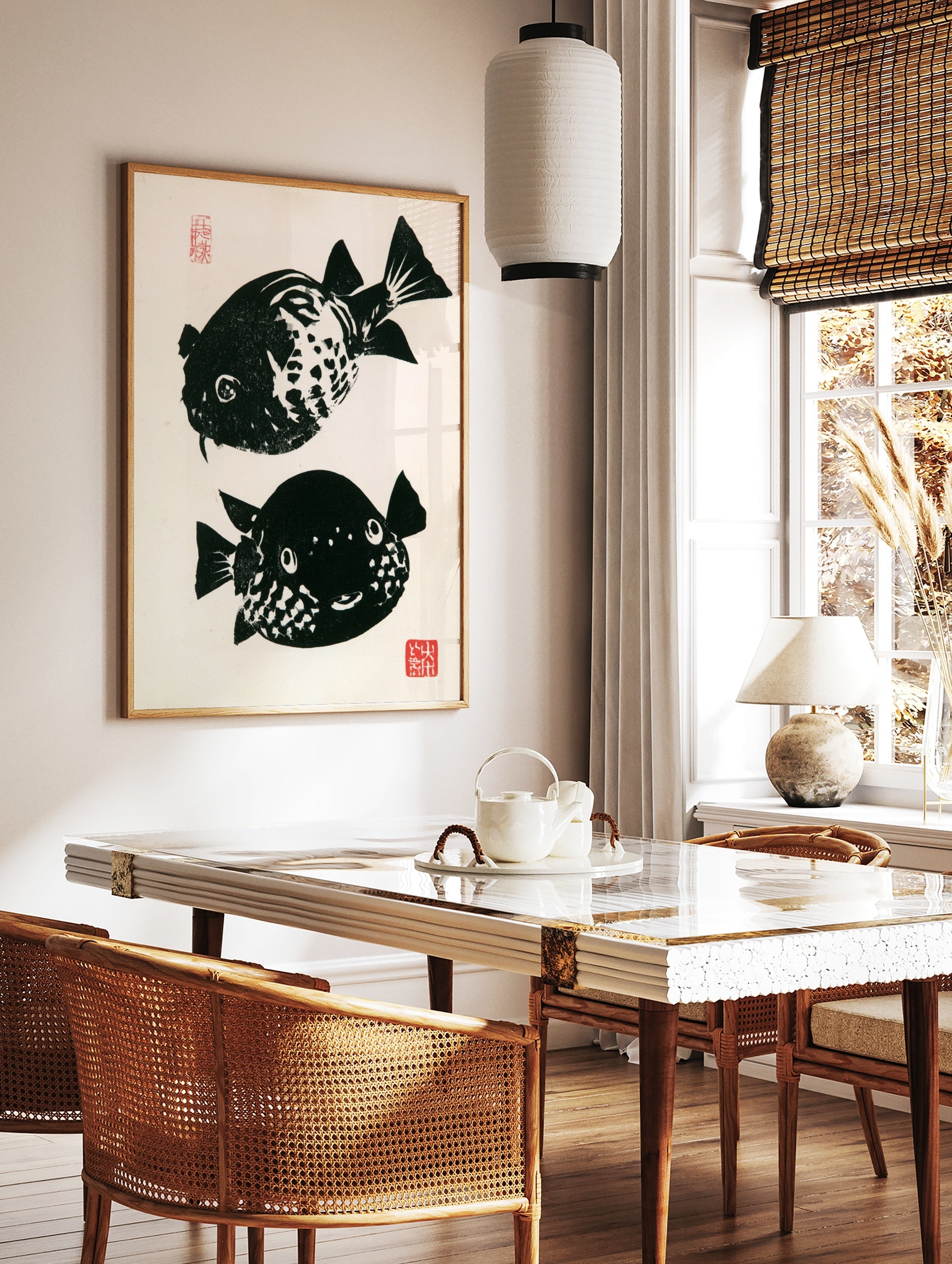 Japanese woodblock style pufferfish print with high-contrast black and white fish and red stamps on, in a styled room mockup