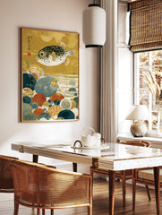 Japanese pufferfish art print with black spots, swimming over colourful seabed pebbles and shells, in a styled room mockup