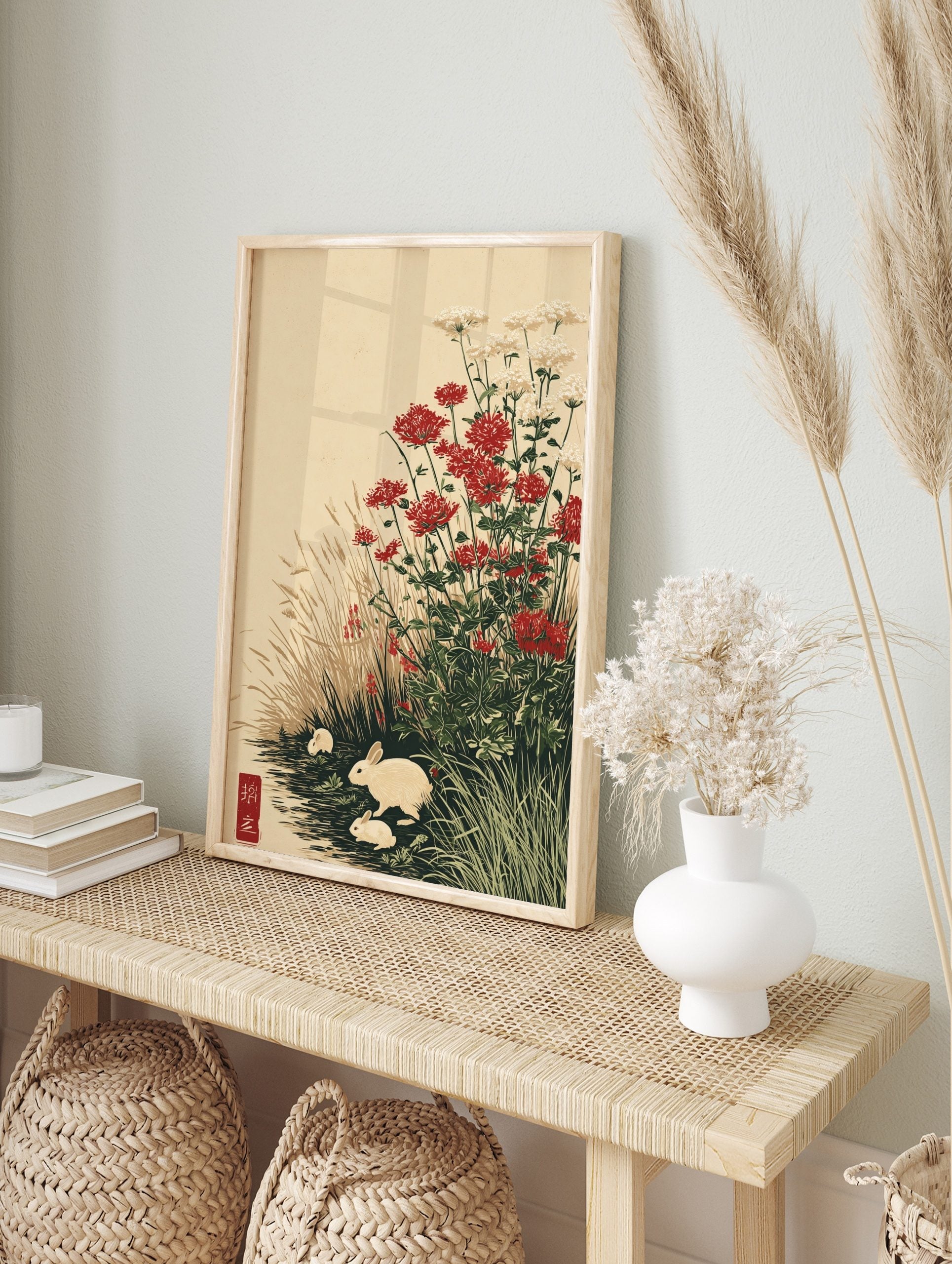 Japanese-style art print with three white rabbits among red and white flowers and tall, in an alternate framed mockup