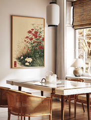 Japanese-style art print with three white rabbits among red and white flowers and tall grasses by, in a styled room mockup
