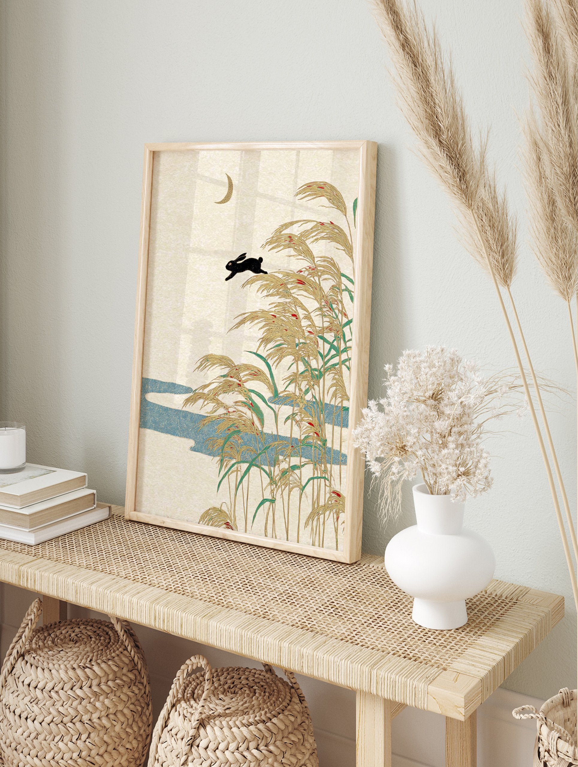 Japanese Rabbit Art print with black rabbit leaping over golden pampas grass, blue river, and crescent moon on a beige background. - Image 3