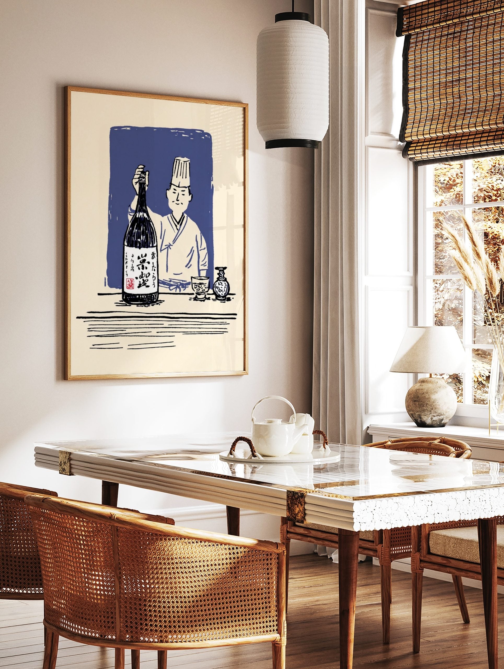Japanese chef in hat holding large sake bottle, with sake cup and carafe on table, blue background, in a styled room mockup