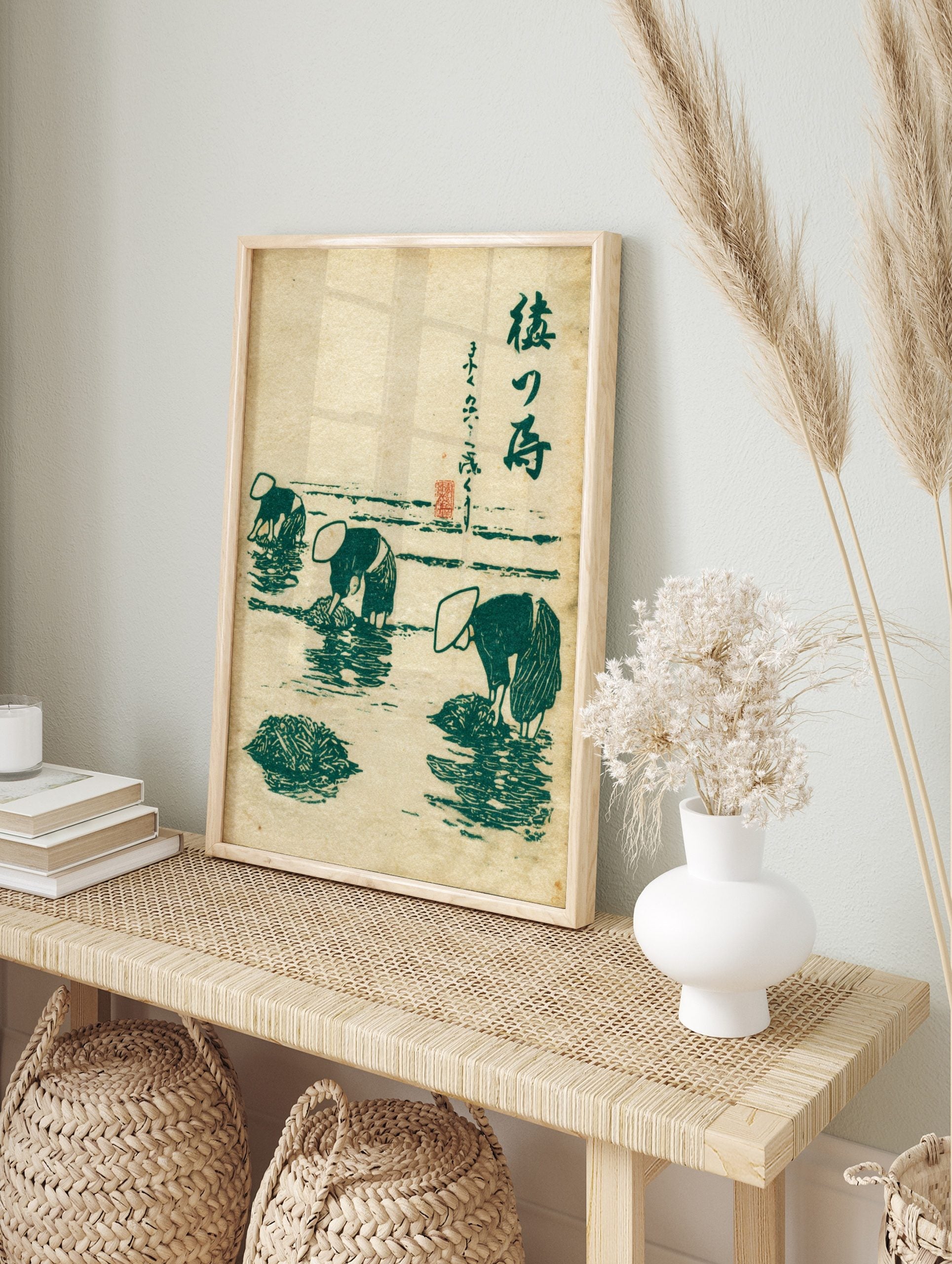 Japanese ukiyo-e style print of three figures in conical hats harvesting seaweed in green and, in an alternate framed mockup