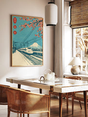 Japanese woodblock-style print of Shinkansen bullet train, Mount Fuji, and red cherry blossoms, in a styled room mockup