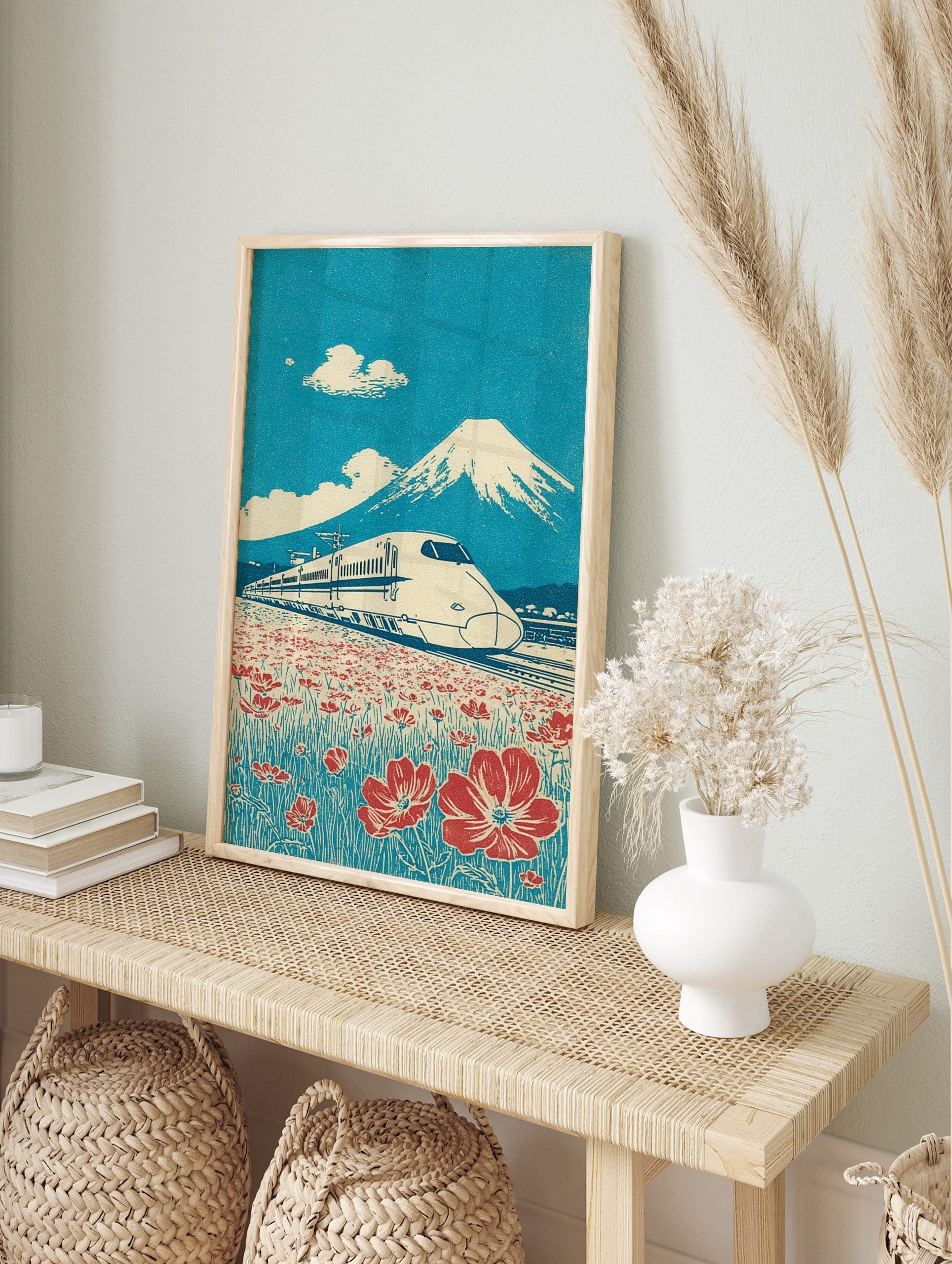 Japanese Shinkansen bullet train passing red flowers with Mount Fuji and blue sky in retro, in an alternate framed mockup