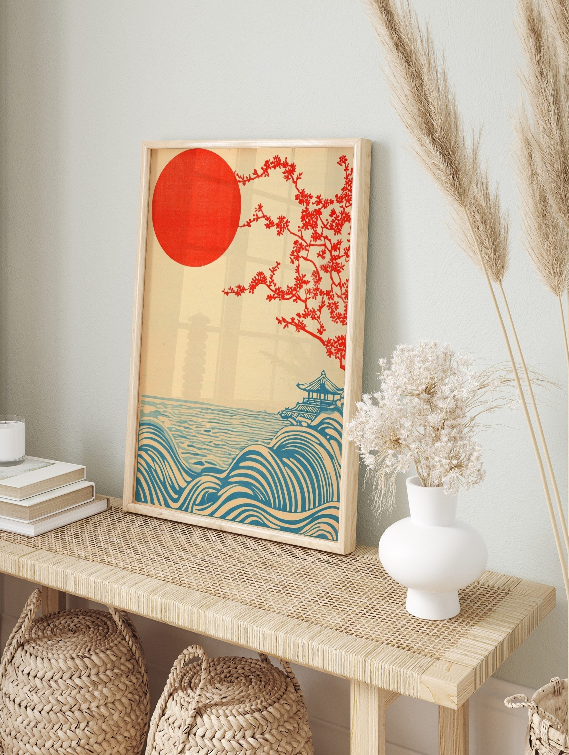Japanese landscape print with red sun, flowering tree, blue waves, and a pagoda on a hill, in an alternate framed mockup