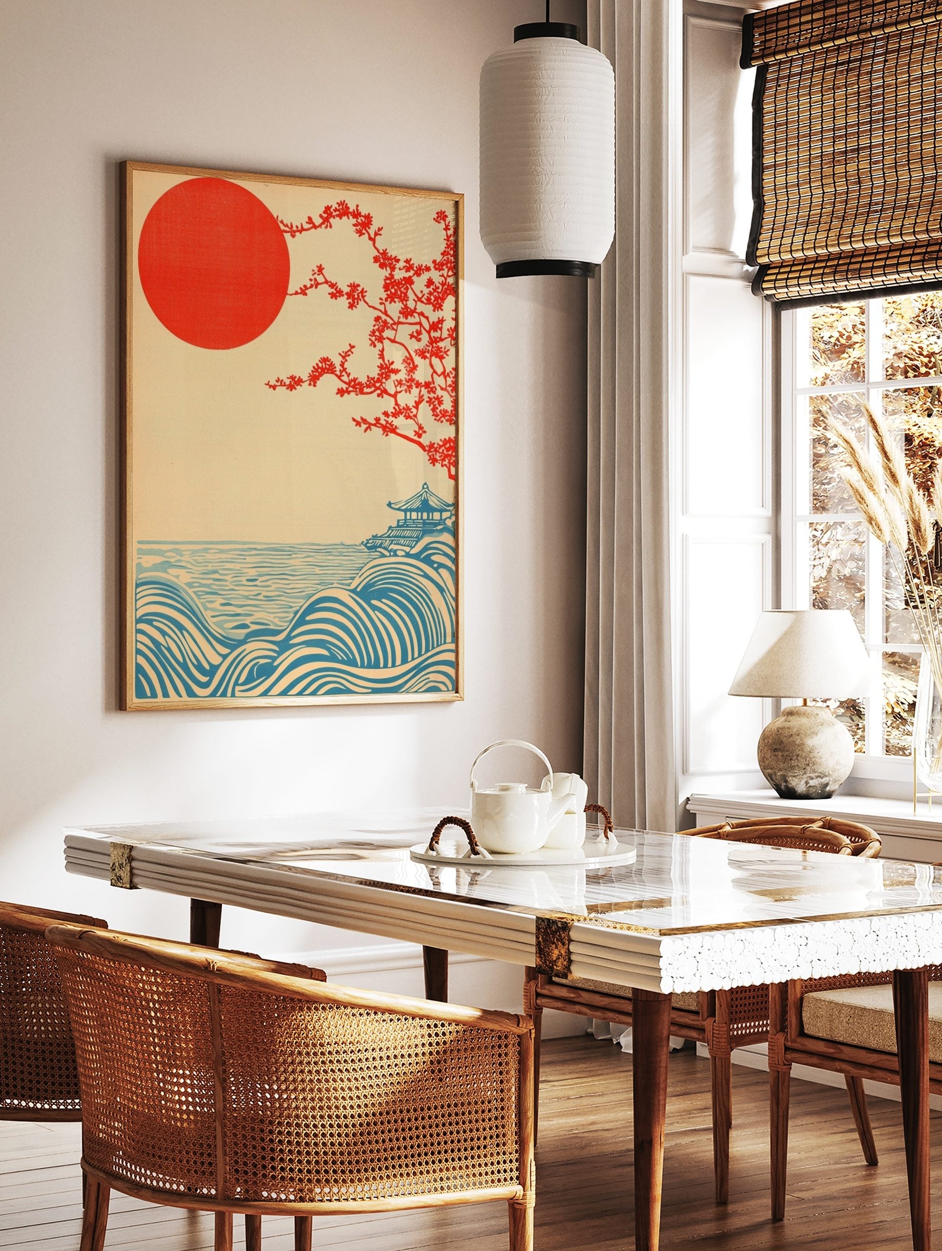 Japanese landscape print with red sun, flowering tree, blue waves, and a pagoda on a hill, in a styled room mockup
