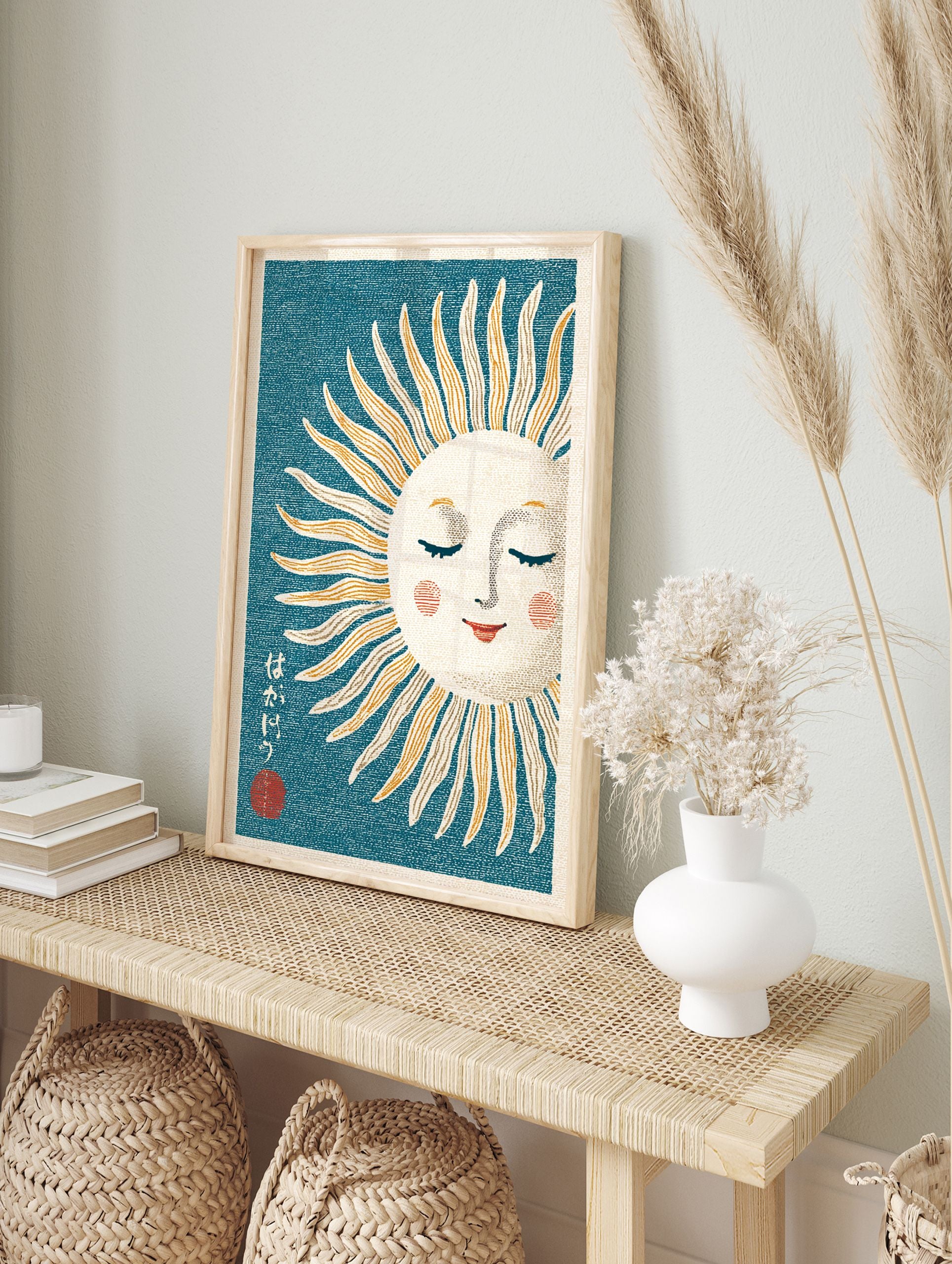 Japanese sun wall art print with a sleeping sun face, orange and cream rays on a teal background with Japanese text. - Image 3