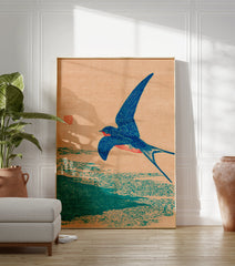 Japanese woodblock print of a blue swallow bird in flight over water against a peach background, vintage style. - Image 3