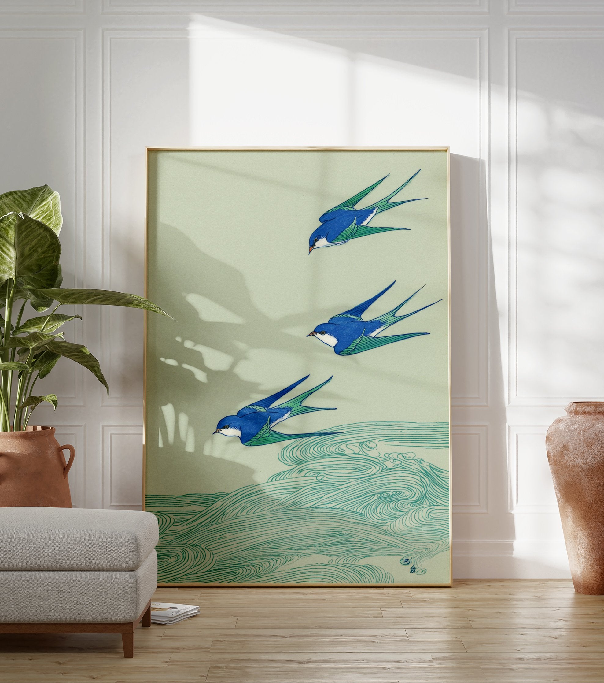 Japanese swallow wall art print showing three blue and green birds flying over teal waves on a light green background. - Image 3