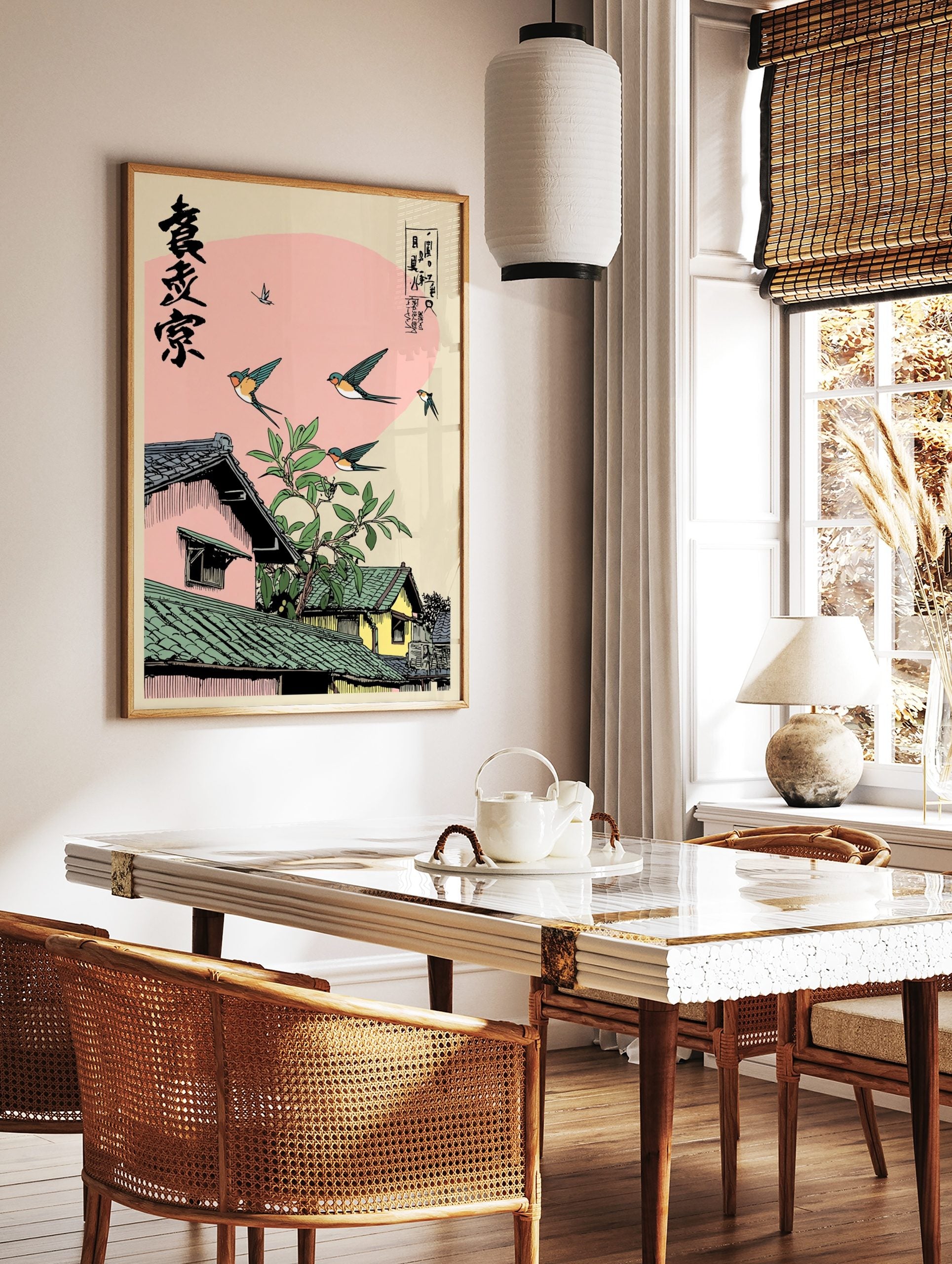 Ukiyo-e style Japanese swallows flying over traditional rooftops with green tiles and a leafy branch, in a styled room mockup
