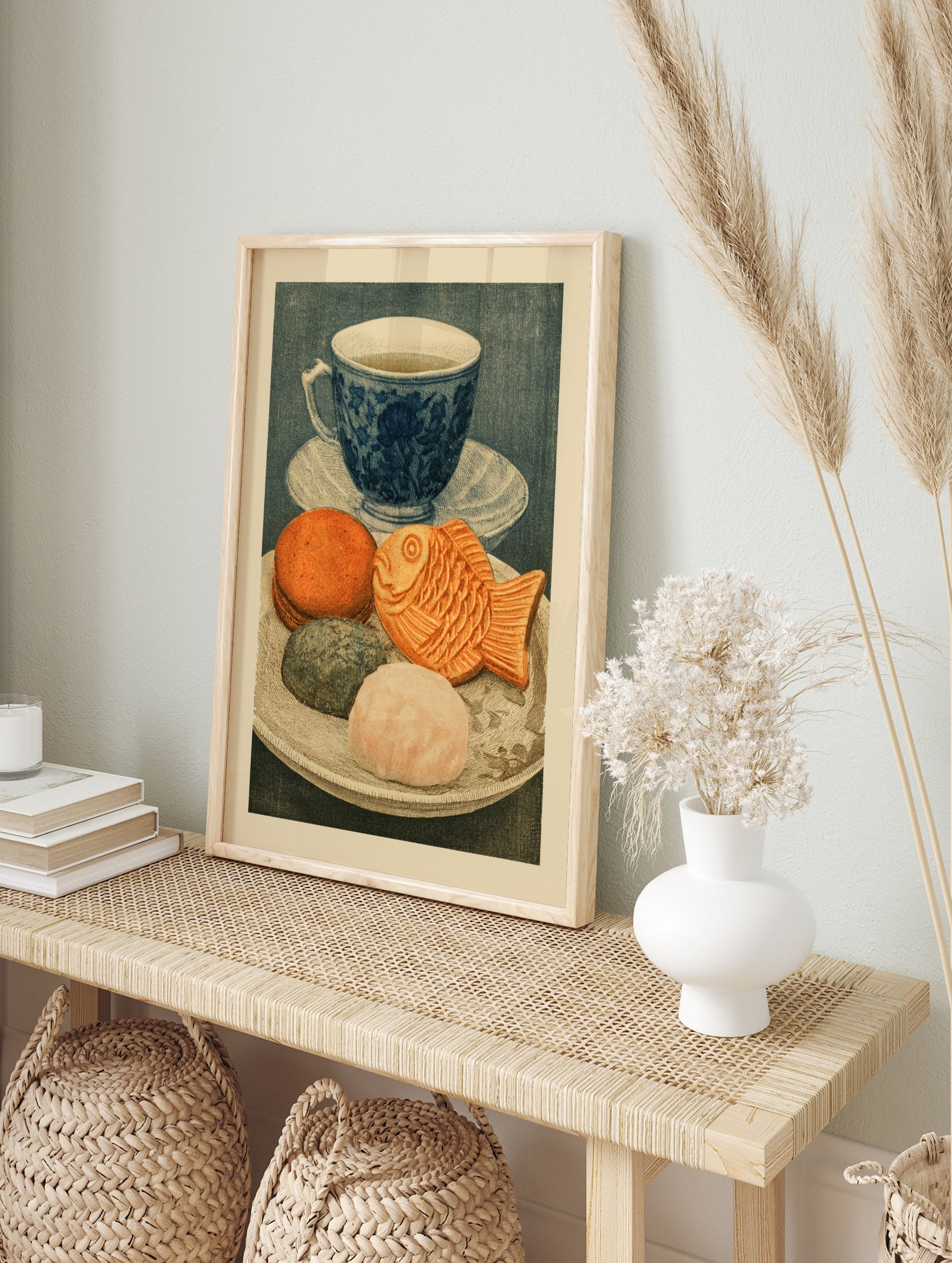 Illustrative art print of a blue tea cup and a plate of Japanese sweets including a, in an alternate framed mockup