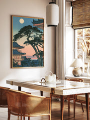 Japanese temple pagoda landscape art print with a full moon and gnarled pine tree in an, in a styled room mockup
